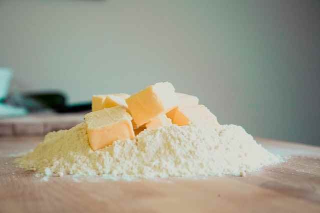 Butter on a table covered in flour in a Butter Company