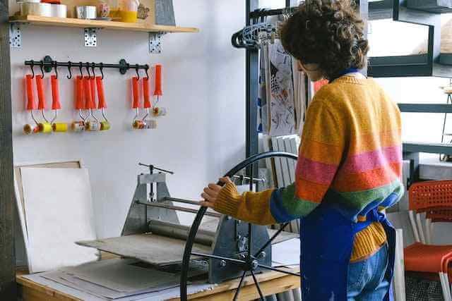 A lady Printing something in a printing shop